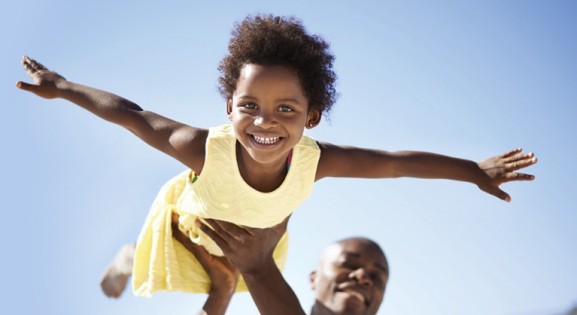 Man Holding Flying Girl blue background