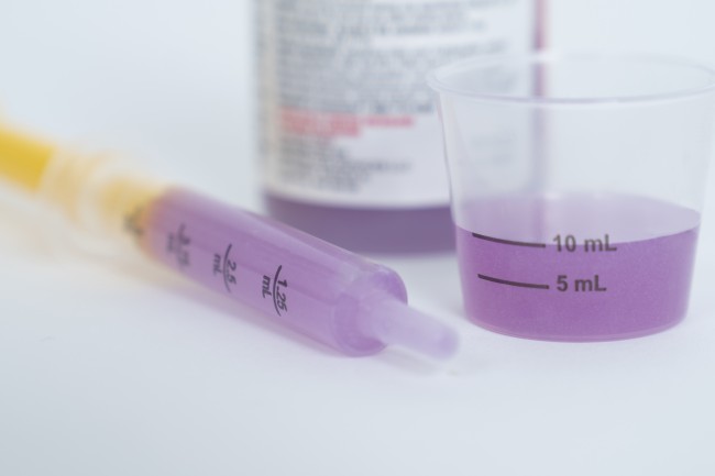 Medicine bottle, dosing cup, and medicine syringe