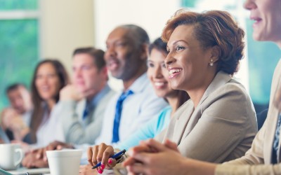 African American Woman and Colleagues in a corporate setting