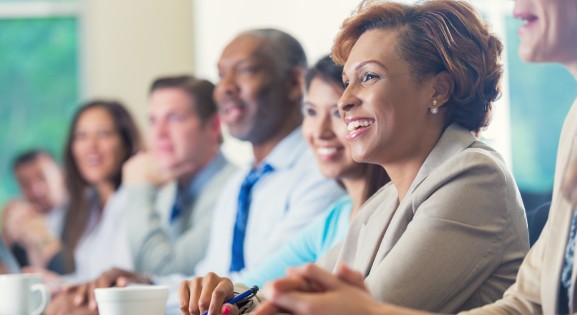 African American Woman and Colleagues in a corporate setting