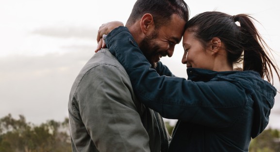 Couple hugging outdoors